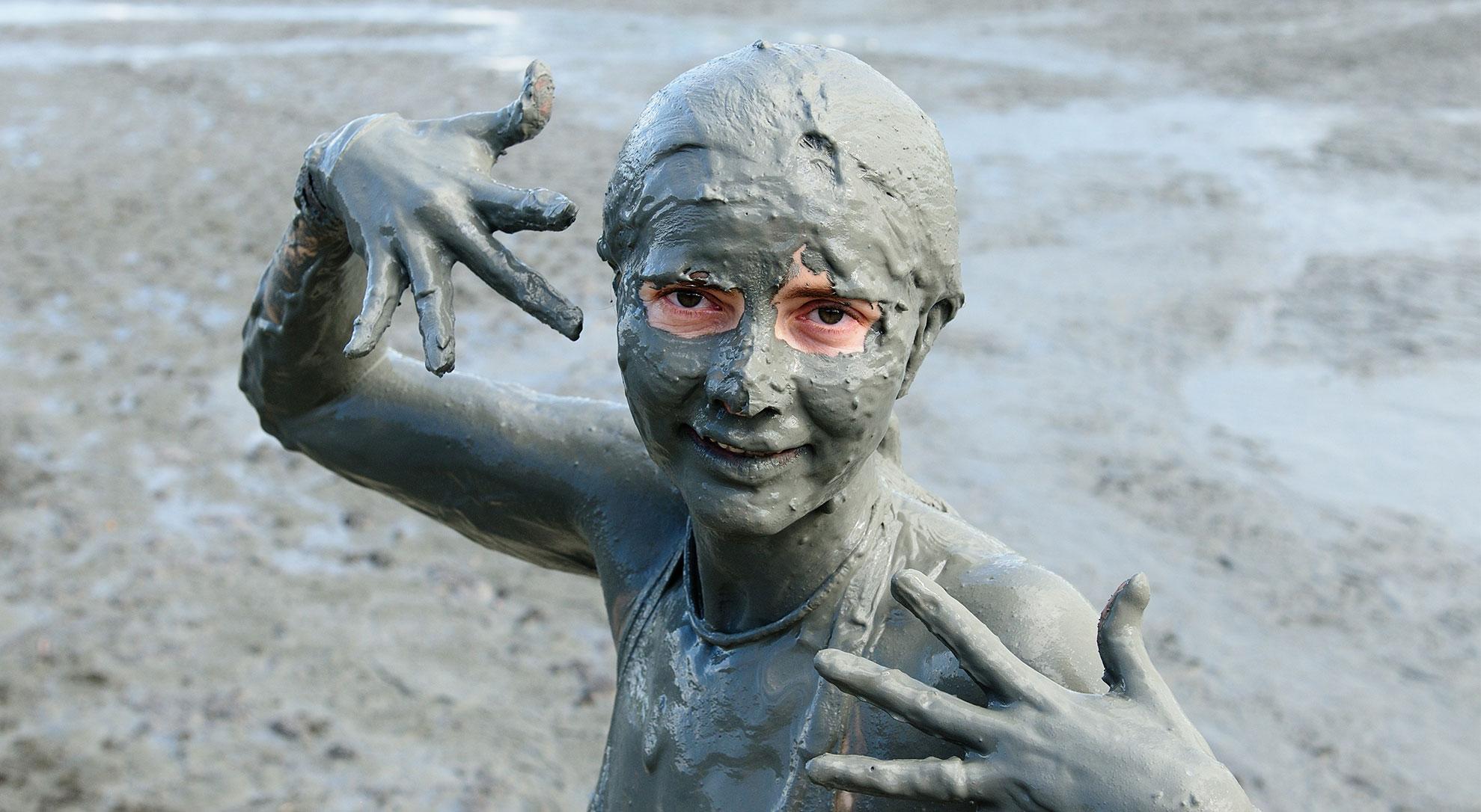 The best skin treatment in the world as depicted by this young woman covered in mud